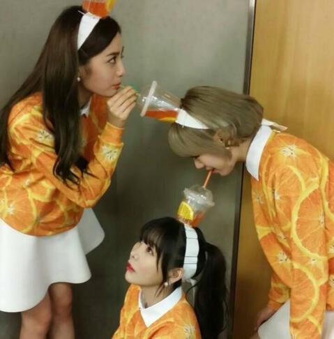 Orange Caramel Lipstick Era drinking eachothers orange juice headbands